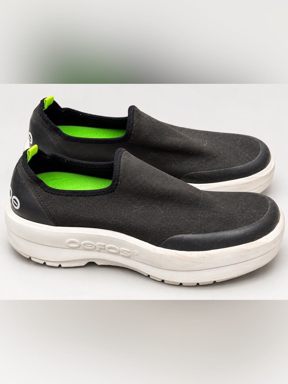 OOFOS Women’s Black Slip-On Loafers with Neon Green Insole